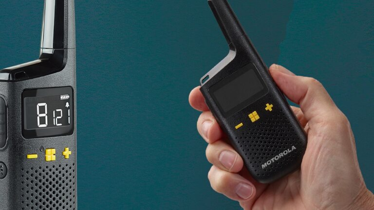 XT185 with Hand Holding Radio Studio3_Edit_Lifestyle